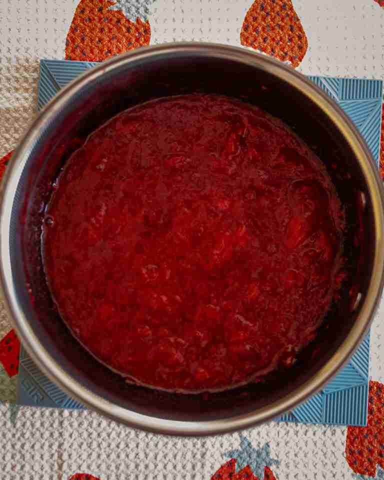20240417-DSC_0028 Strawberry compote mixture in a pot.