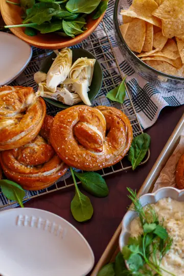 Spinach and artichoke dip stuffed soft pretzels.